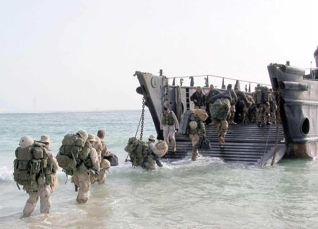 Royal Marines from the 40th Commando unit load onto a Landing Craft ...