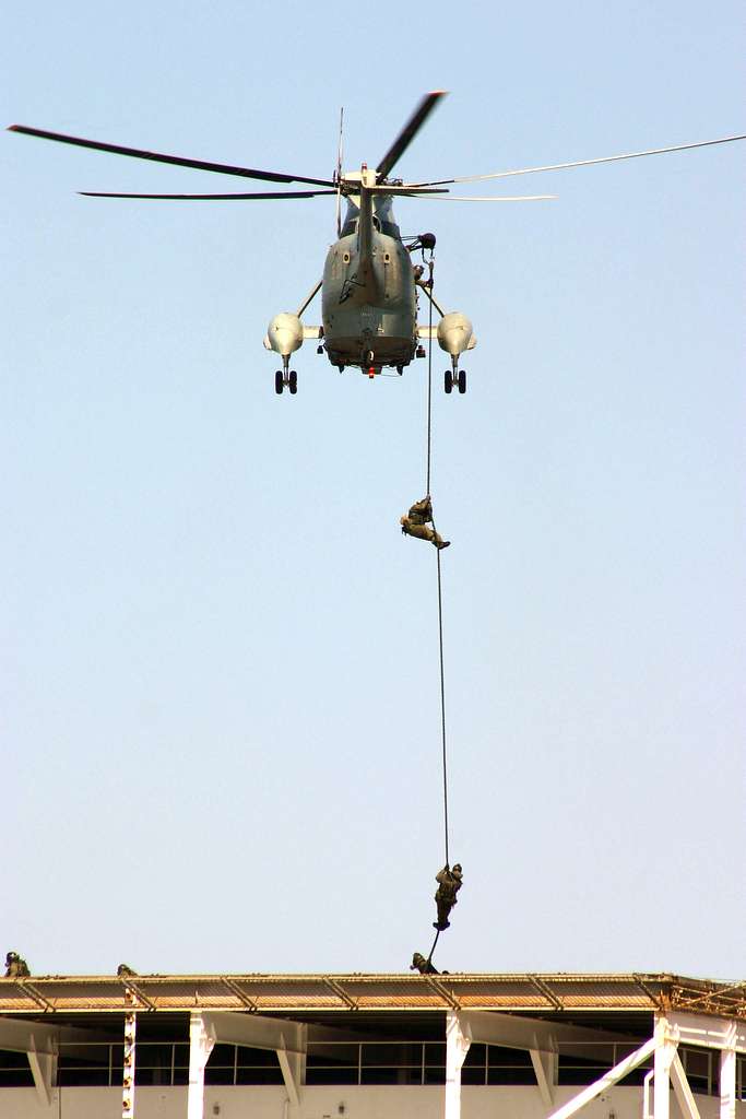 Italian Special Forces personnel FAST rope from an Italian SH-3 helicopter.  - PICRYL - Public Domain Media Search Engine Public Domain Search