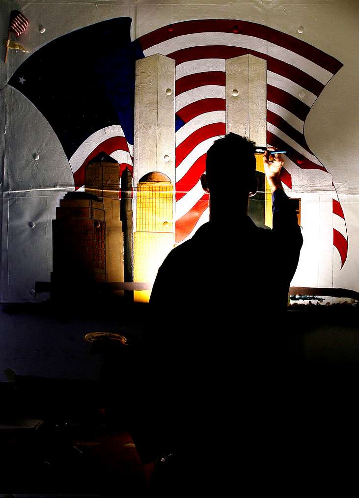 US Navy Engineman 2nd Class Anthony Bartelli (right) holds an