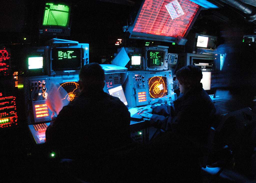 Operations Specialist 2nd Class Gretchen Flint along with Operations  Specialist Seaman Andrew Wilbanks monitor radar in Combat Information  Center (CIC) aboard the amphibious assault ship USS Bataan (LHD 5). -  PICRYL 