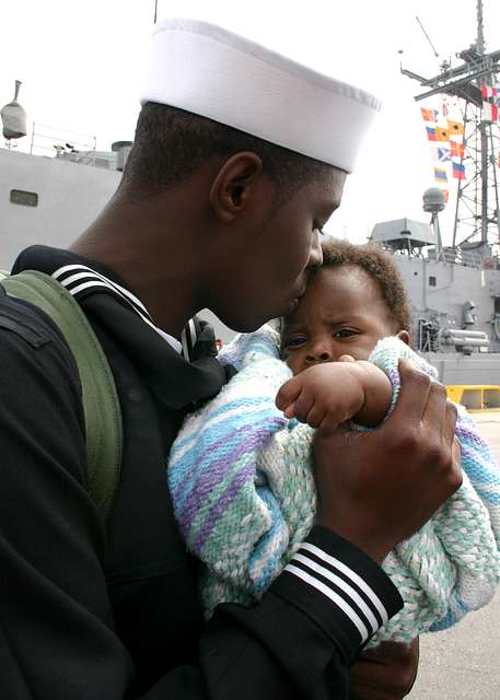 Seaman Brandon King Sr. embraces his five-month old son for the first ...