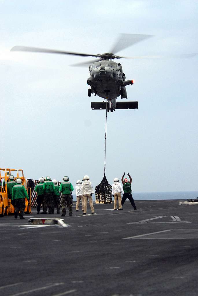 Competitors conduct a static line jump from a C-130 - PICRYL