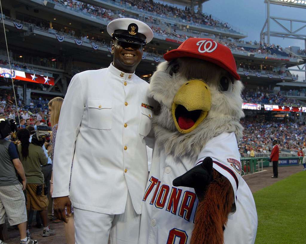 WASHINGTON (May 14, 2019) Screech, the Washington Nationals mascot, shakes  hands with Personnel Specialist 1st Class Angelita Baggoo, Navy Reserve  Sailor of the Year, at Nationals Park in Washington, D.C. - PICRYL 