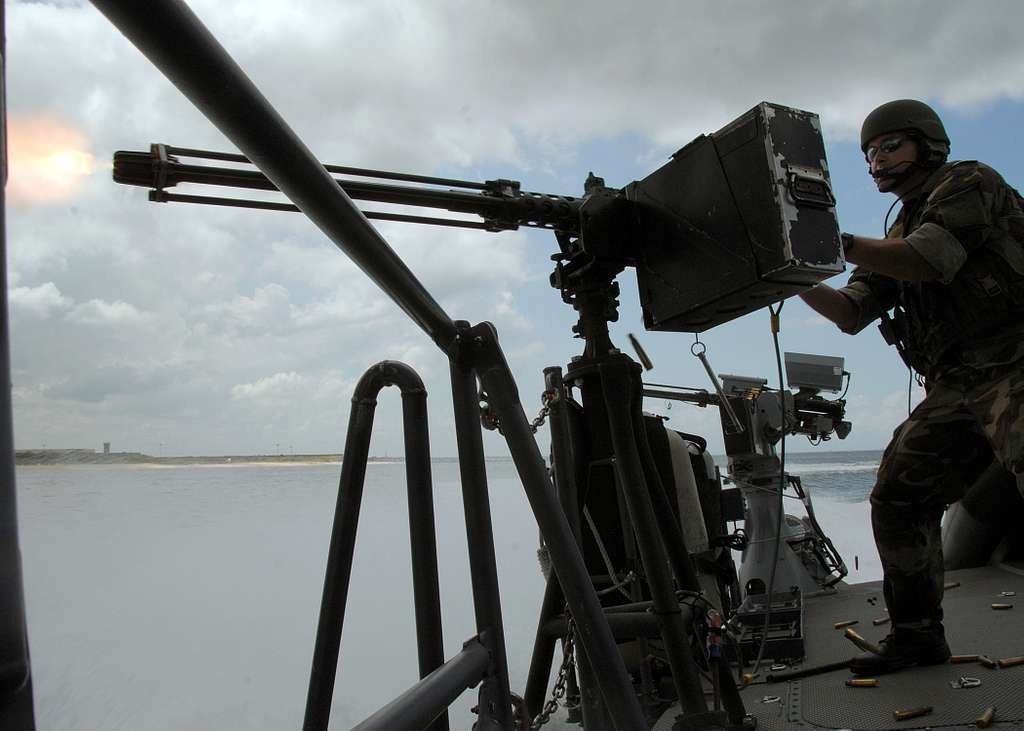 A Special Warfare Combatant-craft Crewman Fires A .50 Caliber Machine ...