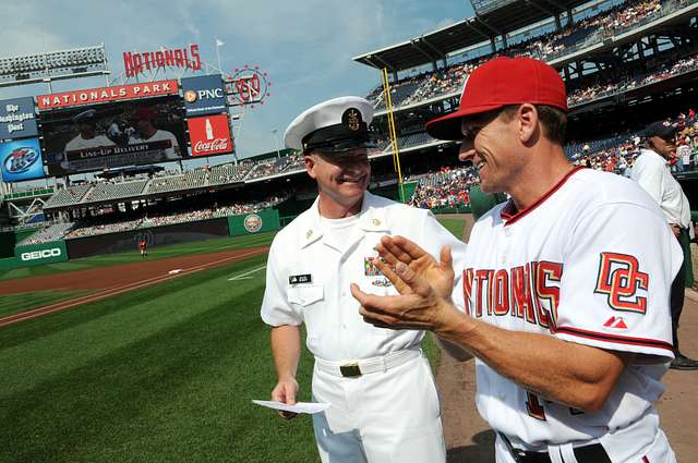 WASHINGTON (May 14, 2019) Screech, the Washington Nationals mascot, shakes  hands with Personnel Specialist 1st Class Angelita Baggoo, Navy Reserve  Sailor of the Year, at Nationals Park in Washington, D.C. - PICRYL 