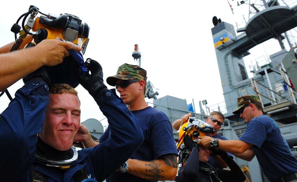 Navy diver ensures a proper seal on the Kirby Morgan 37 di…