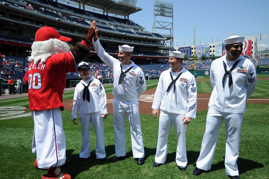 WASHINGTON (May 14, 2019) Screech, the Washington Nationals mascot, shakes  hands with Personnel Specialist 1st Class Angelita Baggoo, Navy Reserve  Sailor of the Year, at Nationals Park in Washington, D.C. - PICRYL 