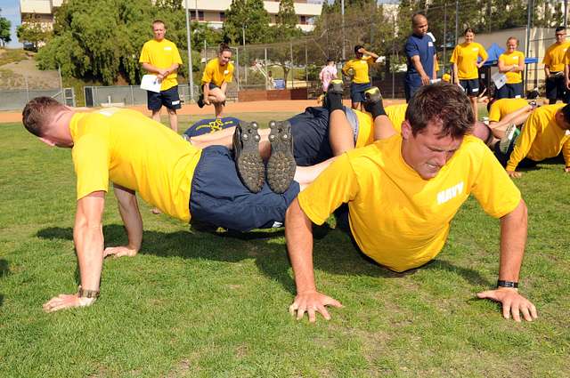 A man in a red shirt doing a push up. Sport fitness exercise, sports. -  PICRYL - Public Domain Media Search Engine Public Domain Search