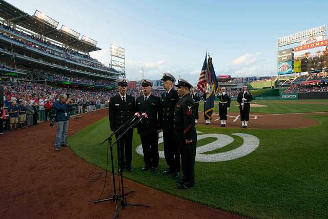 Screech, the Washington Nationals' mascot, offers Chief Navy Career  Counselor Michael Robinson his cover. - PICRYL - Public Domain Media Search  Engine Public Domain Search