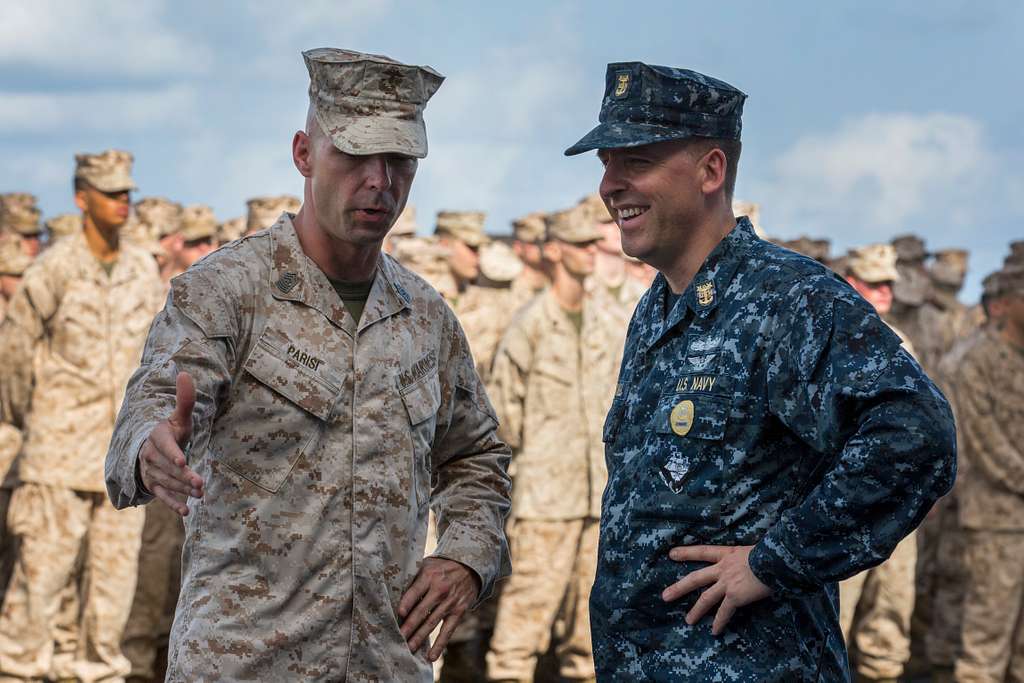 Command Sgt. Maj. Todd Parisi speaks with Command Master Chief David ...