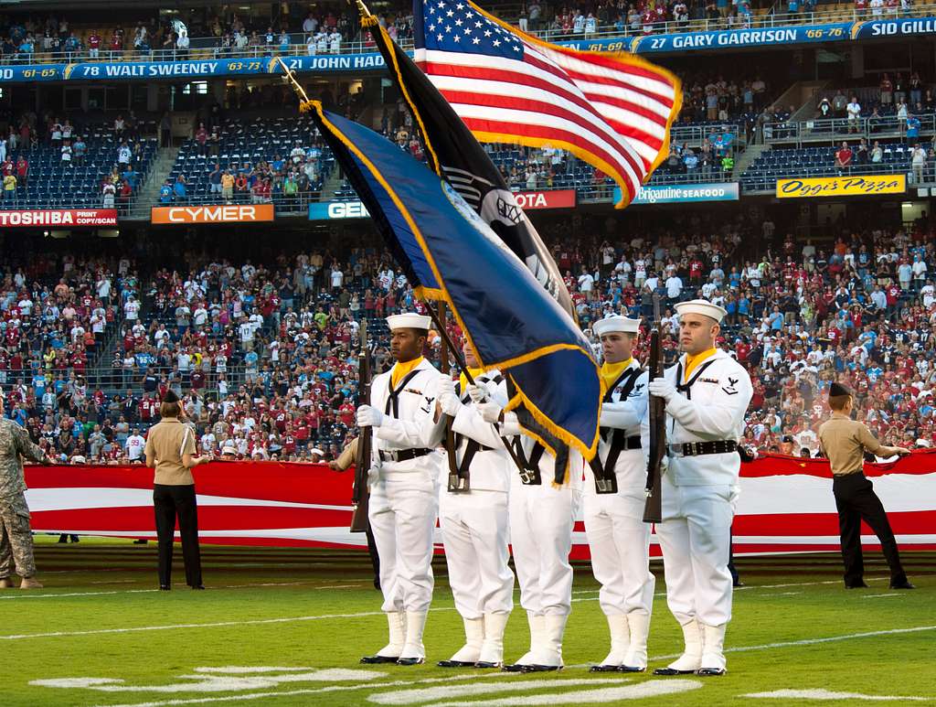 SAN DIEGO (April 24, 2016) Members of the color guard from the aircraft  carrier USS Theodore Roosevelt (CVN 71) parade the colors on the field at  Petco Park, home field of the