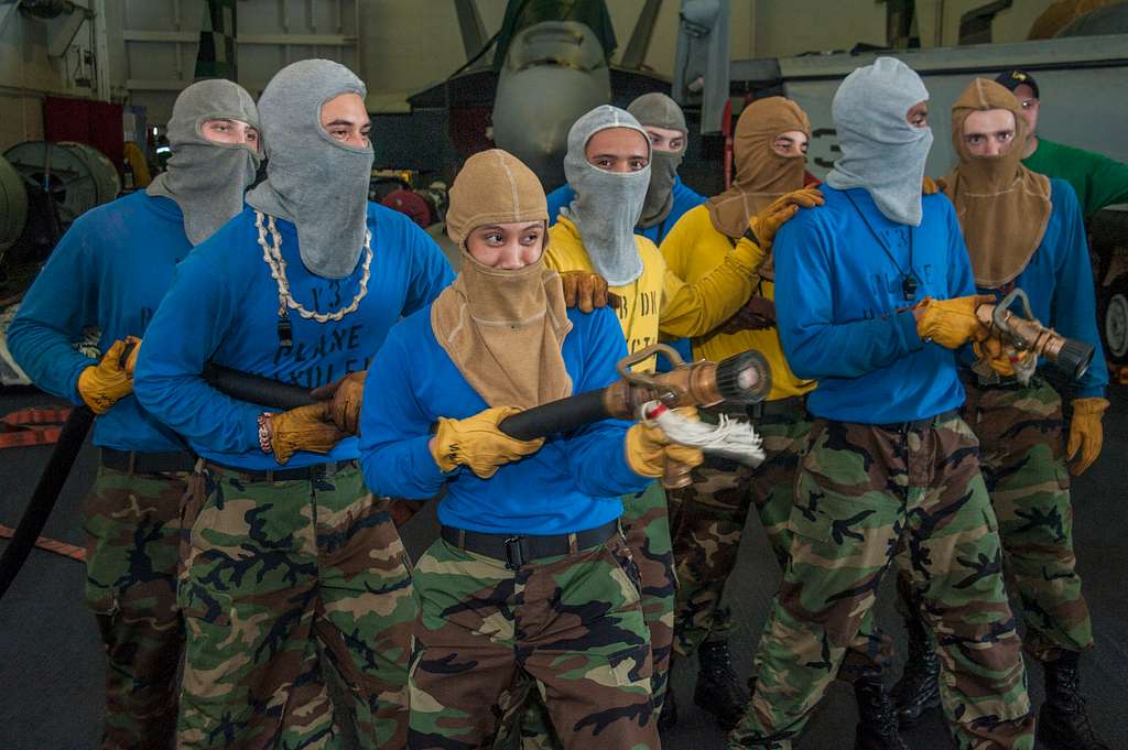 Sailors fight a simulated fire during a mass casualty drill in the hangar  bay of the aircraft carrier USS George Washington (CVN 73). - PICRYL -  Public Domain Media Search Engine Public Domain Image