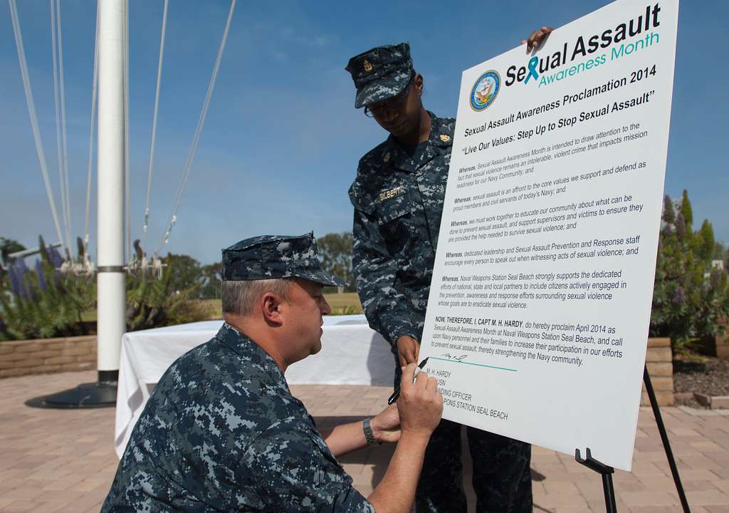 Chief Yeoman Kiona Gilbert Holds A Sexual Assault Awareness Month Proclamation As It Is Signed By Capt Tripp Hardy Picryl Public Domain Image