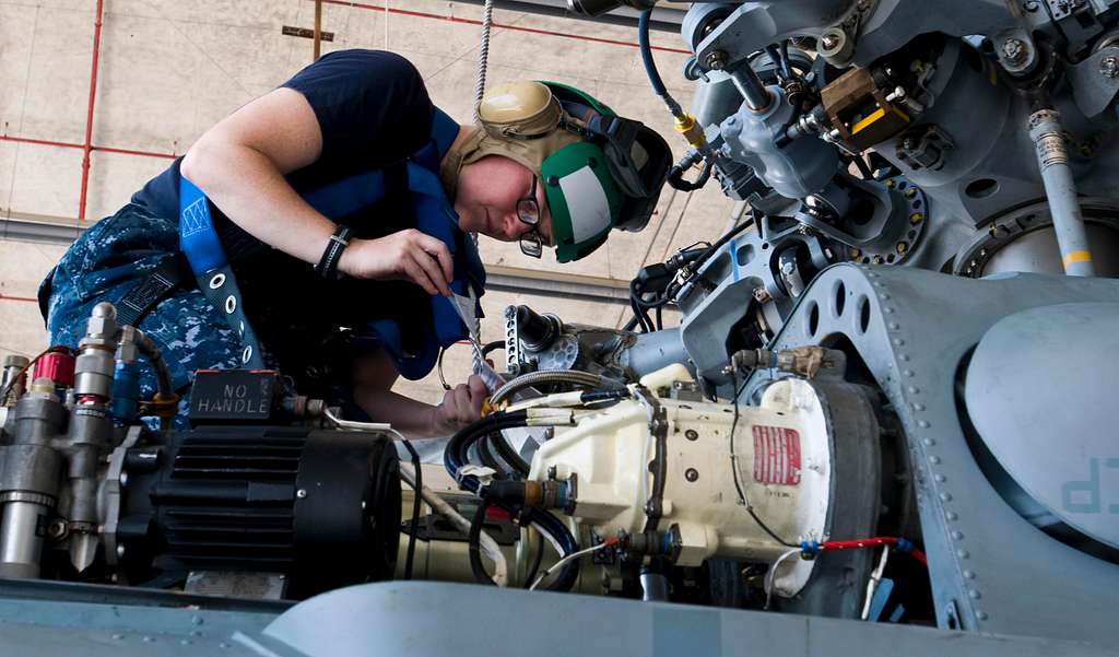 Offensive Tackle for the National Football League (NFL) San Diego Chargers,  Leander Jordan (75), signs an autograph for Aviation Electrician's Mate 3rd  Class Jerimy Holt during a visit aboard USS Ronald Reagan (