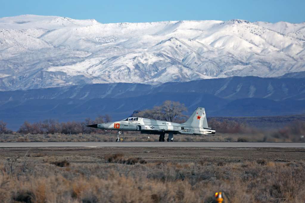 F-5 from the VFC-13 Saints hiking the gear and heading out of