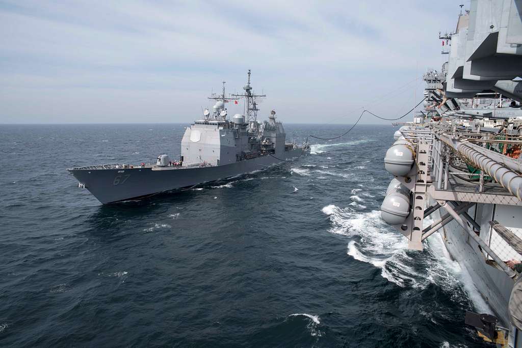 Amphibious assault ship USS Bonhomme Richard (LHD 6) and guided-missile ...