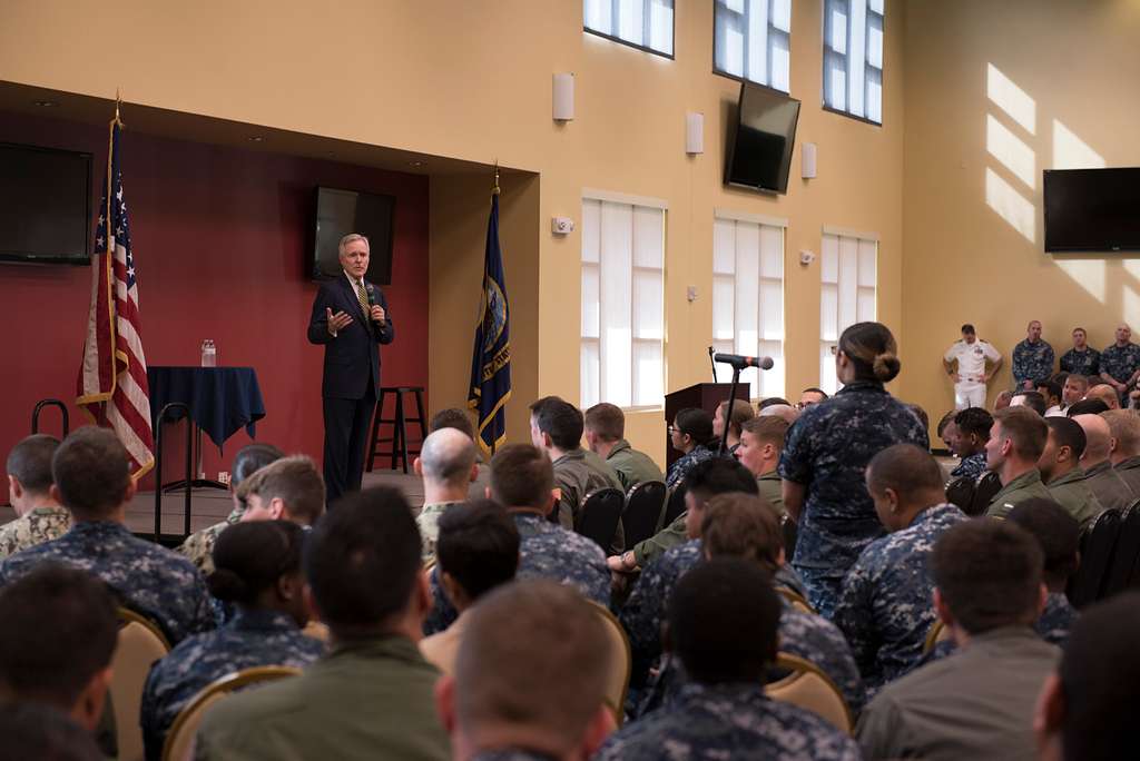 Navy Secretary Ray Mabus shakes the hands of the female service