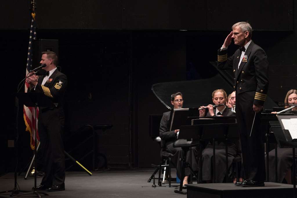 Captain Ken Collins, commanding officer of the U.S. Navy Band, center ...