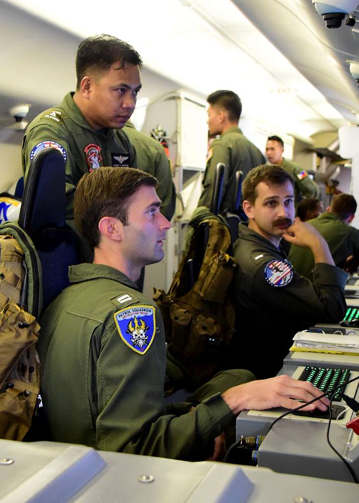 Lt. Carson Burton bottom left and Lt. j.g. Nicholas Wohar right