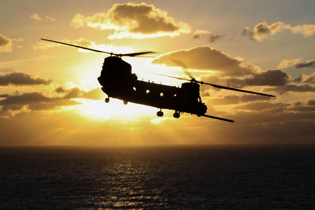 A U.S. Army CH-47 Chinook helicopter takes off from the aircraft ...