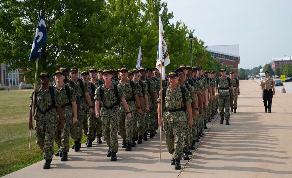 LAKES, Ill. (Nov. 14, 2017) Recruits march down a street at Recruit  Training Command (RTC) while wearing the Navy Working Uniform (NWU) Type  III uniforms. The new camouflage uniforms started being issued