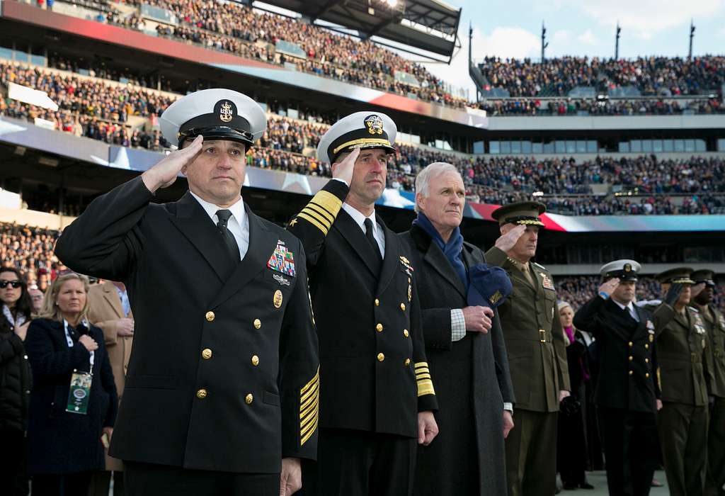 File:US Navy 070208-N-4965F-001 A young patron hands a football to