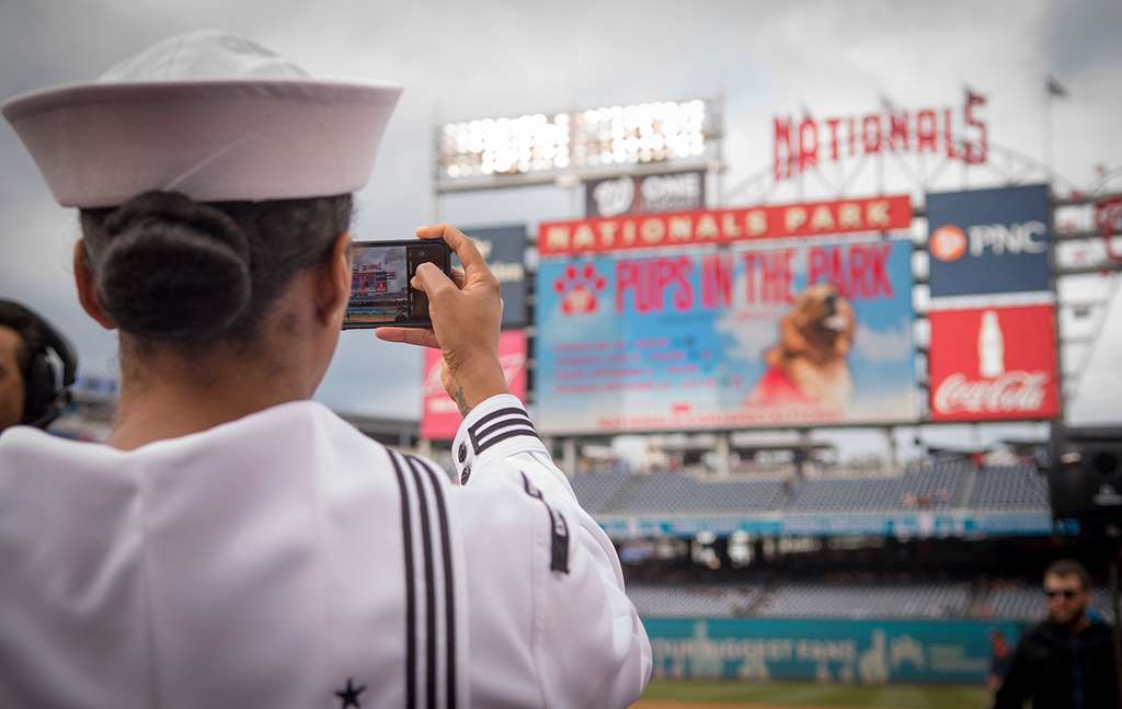 WASHINGTON (May 14, 2019) Screech, the Washington Nationals mascot, shakes  hands with Personnel Specialist 1st Class Angelita Baggoo, Navy Reserve  Sailor of the Year, at Nationals Park in Washington, D.C. - PICRYL 