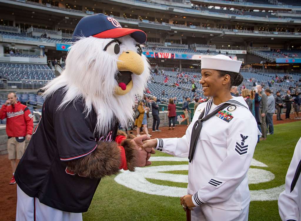 WASHINGTON (May 14, 2019) Screech, the Washington Nationals mascot, shakes  hands with Personnel Specialist 1st Class Angelita Baggoo, Navy Reserve  Sailor of the Year, at Nationals Park in Washington, D.C. - PICRYL 