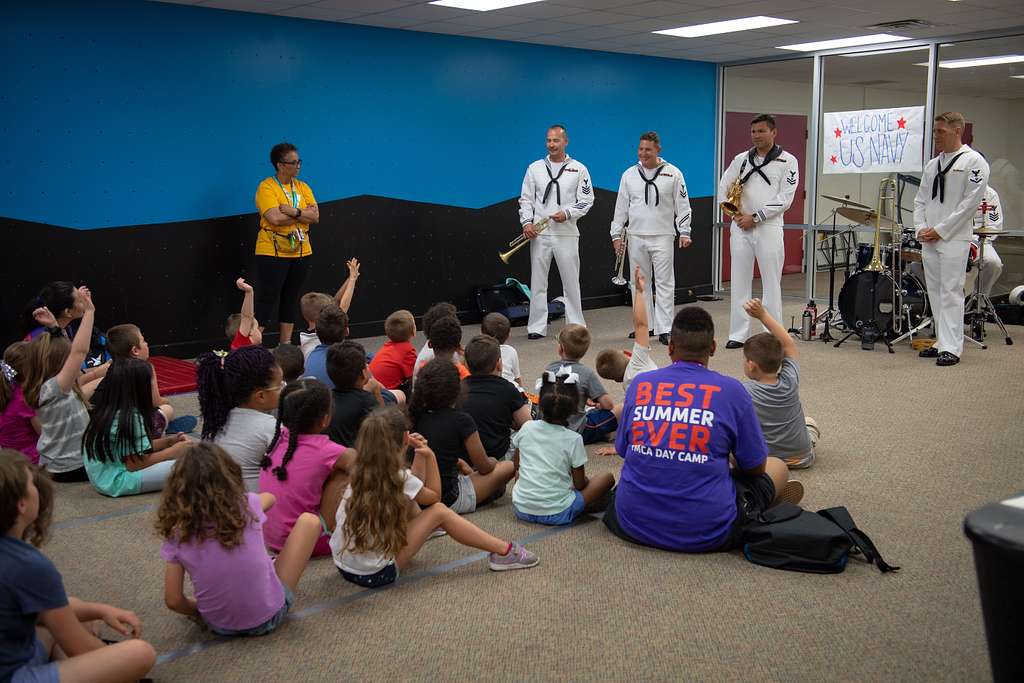 The 32nd Street Brass Band from Navy Band Southwest answer questions from  kids at the North Side YMCA during Oklahoma City Navy Week 2019. - PICRYL -  Public Domain Media Search Engine