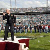 Musician 3rd Class and American Idol finalist Phil Stacey embraces