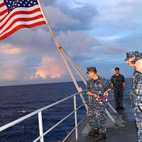 File:US Navy 111028-N-JH293-028 Capt. Thomas P. Stanley, commanding officer  of the submarine tender USS Emory S. Land (AS 39), is rendered honors as  he.jpg - Wikimedia Commons