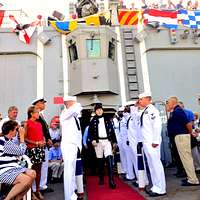 File:US Navy 111028-N-JH293-028 Capt. Thomas P. Stanley, commanding officer  of the submarine tender USS Emory S. Land (AS 39), is rendered honors as  he.jpg - Wikimedia Commons