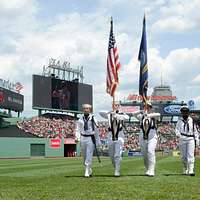 180411-N-SM577-0304 BIRMINGHAM, Ala. (April 11, 2018) Sailors assigned to  USS Constitution post the colors during the national anthem at the opening  day game of the Birmingham Barons baseball team during Navy Week