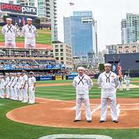 SAN DIEGO (April 24, 2016) Members of the color guard from the aircraft  carrier USS Theodore Roosevelt (CVN 71) parade the colors on the field at  Petco Park, home field of the