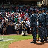 SAN DIEGO (April 24, 2016) Members of the color guard from the aircraft  carrier USS Theodore Roosevelt (CVN 71) parade the colors on the field at  Petco Park, home field of the