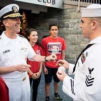 WASHINGTON (May 14, 2019) Screech, the Washington Nationals mascot, shakes  hands with Personnel Specialist 1st Class Angelita Baggoo, Navy Reserve  Sailor of the Year, at Nationals Park in Washington, D.C. - PICRYL 